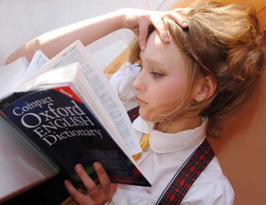 a girl reading igcse book